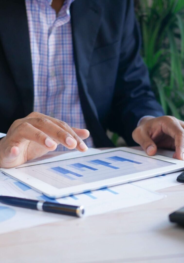 a person looking at a graph on a tablet